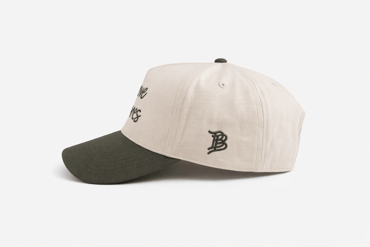 a white and green baseball cap